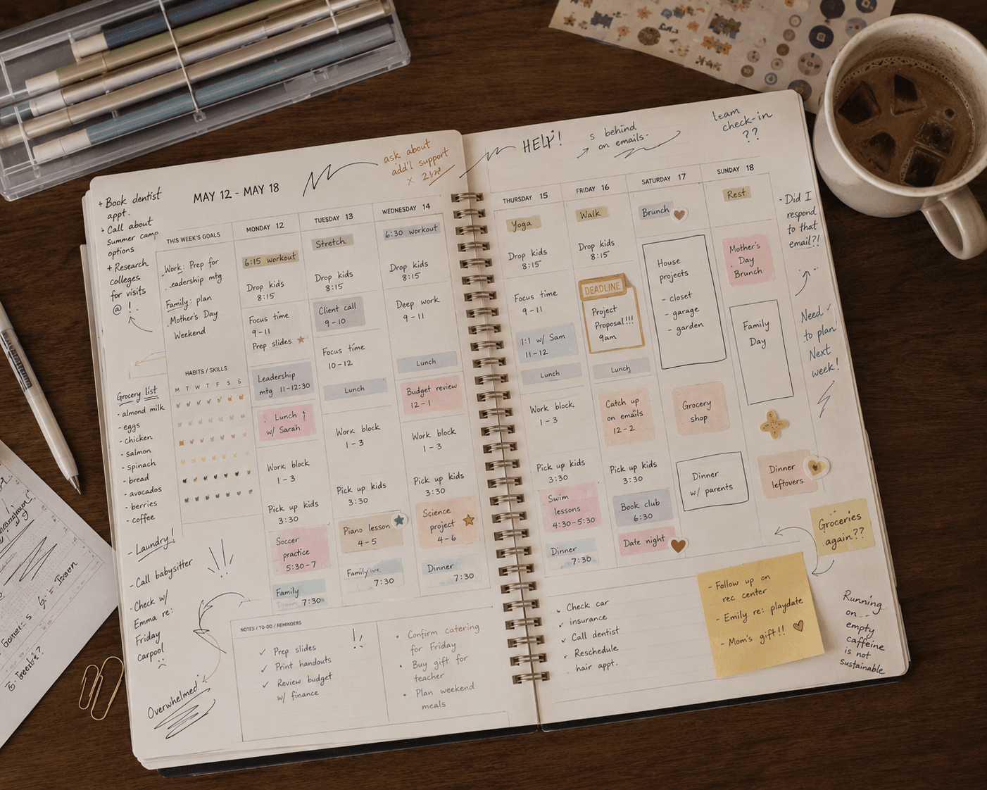 An open planner packed with handwritten tasks and appointments, with 'HELP!' scrawled across the week
