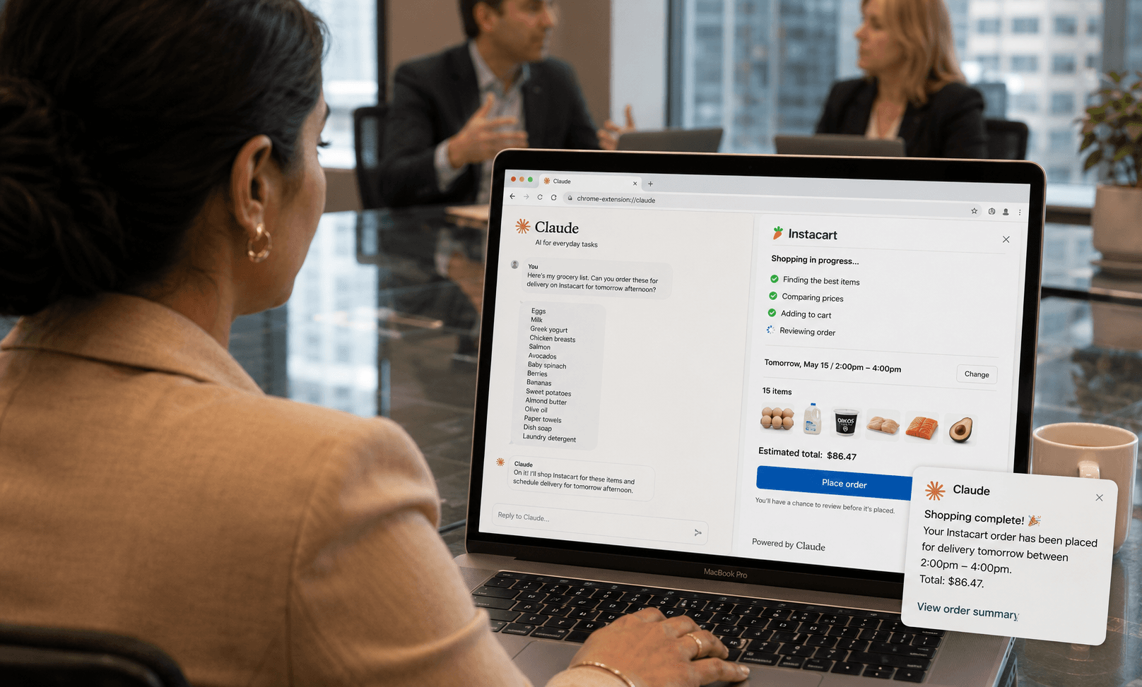 Woman in a glass-walled boardroom glancing at a filled Instacart cart in a window on her laptop, the cheapest store already selected, ready for her to confirm.